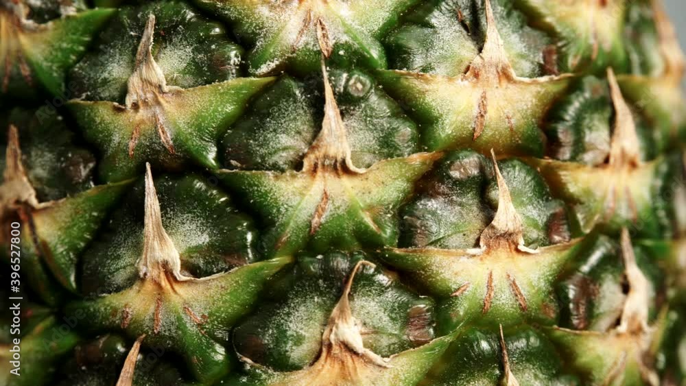 Close up of fresh pineapple ananas fruit skin as rotating food background. Healthy eating. Close up of fresh pineapple ananas fruit skin as rotating food background. Healthy eating.