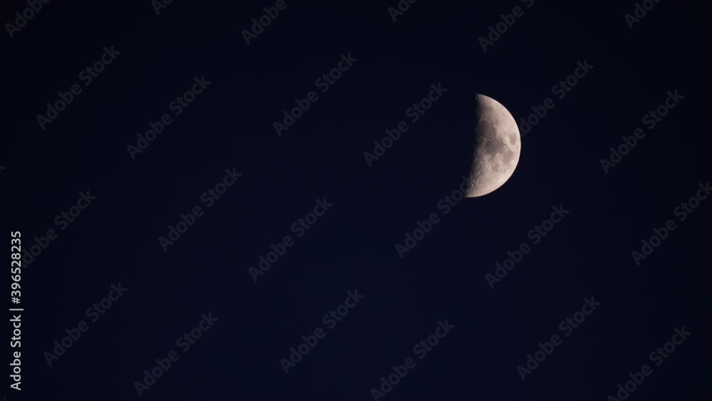 Half moon at night on black sky, moonlight. Half moon at night on black sky, moonlight.