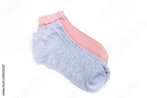 two pairs of colored short socks on a white background, top view