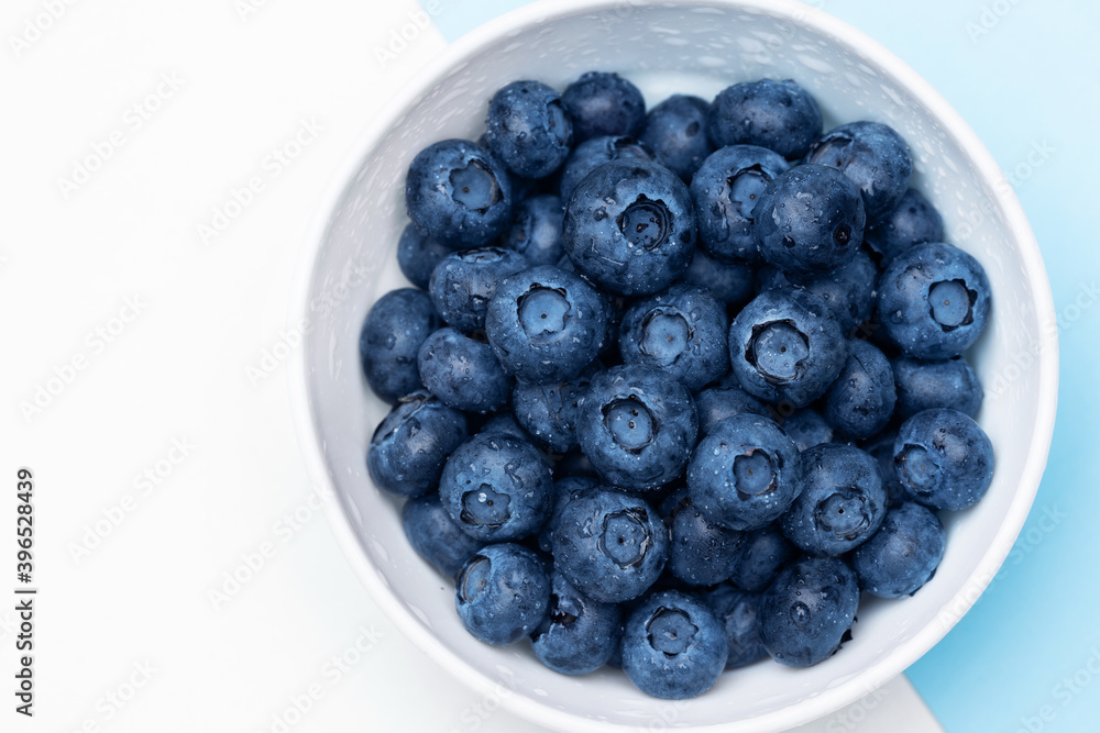 Fresh blueberries in bowl isolated on white. Top view. Fresh blueberries in bowl isolated on white. Top view.