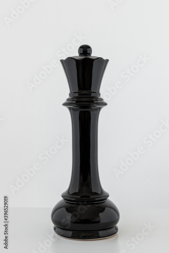 Black queen chess piece on off white background © Rawpixel.com