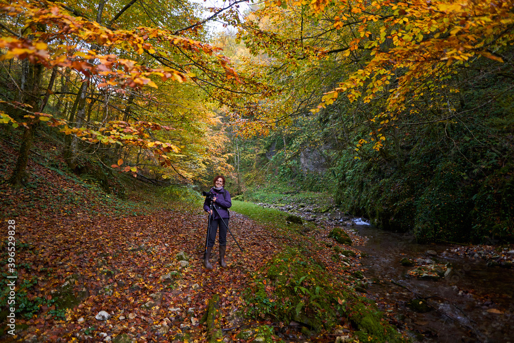 Woman nature photographer with camera Woman nature photographer with camera