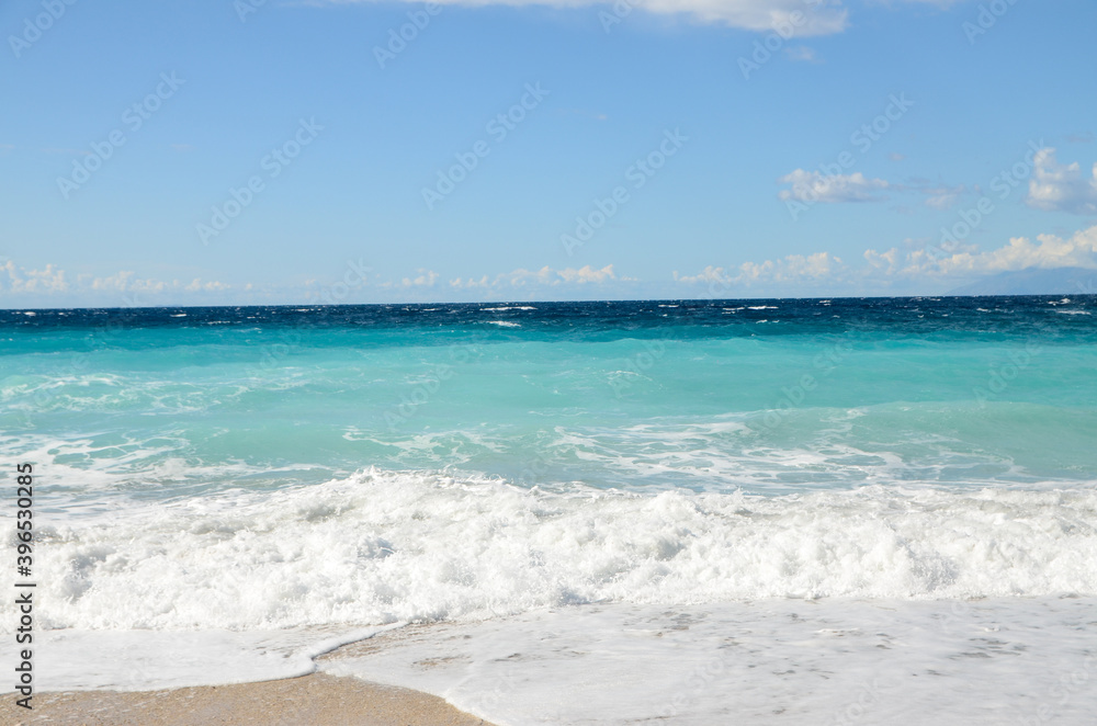 Tropical Beach with golden sand and blue waves. Huge foamy wave. Sea waves breaking on shore. Landscape. Beautiful sandy beach at summer. Ocean waves crushing on wild beach. Tropical Beach with golden sand and blue waves. Huge foamy wave. Sea waves breaking on shore. Landscape. Beautiful sandy beach at summer. Ocean waves crushing on wild beach.