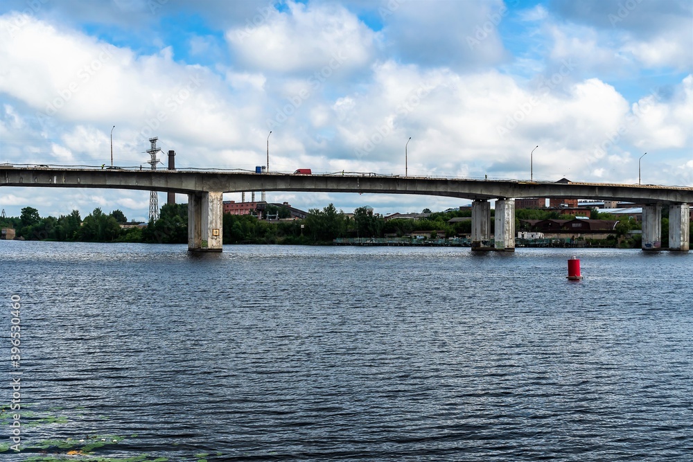 Russia, Kostroma, July 2020 . Fragment of a large concrete bridge over the river.