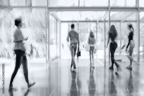 group of people in the lobby business center in monochrome blue tonality