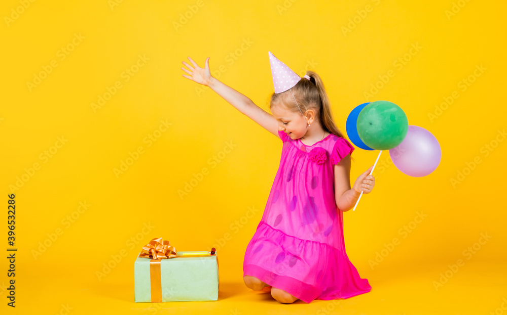 Fototapeta premium best party. imagination and inspiration. birthday party present. small girl with balloon. prepare for holiday. ready to celebrate. concept of dreaming. childhood happiness. kid fashion beauty