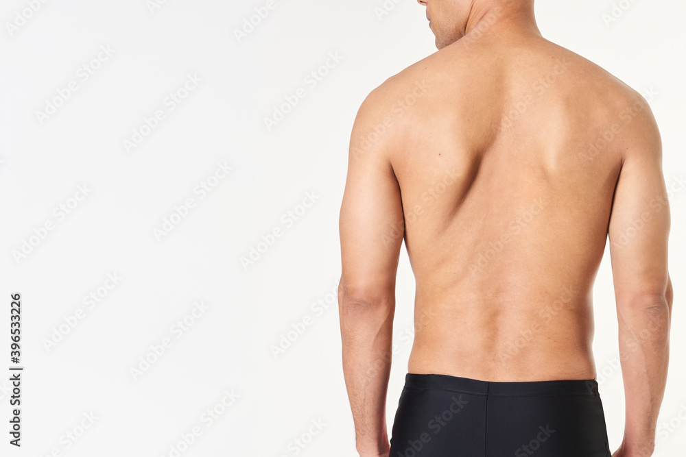 Man wearing tight swimming trunks