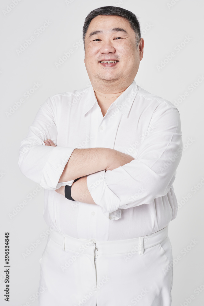 Plus size men's white shirt fashion shoot in studio Plus size men's white shirt fashion shoot in studio