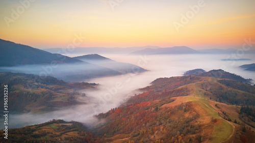 Beautiful Autumn mountain panorama. Fantastic fall sunrise