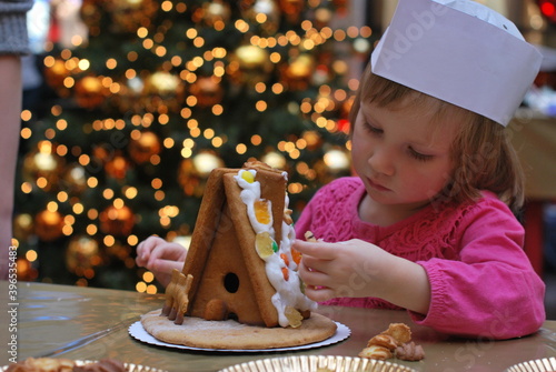 child with gingerbread house