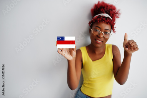 Brazilian woman with afro hair hold Amazonas flag isolated on white background, show thumb up. States of Brazil concept. photo