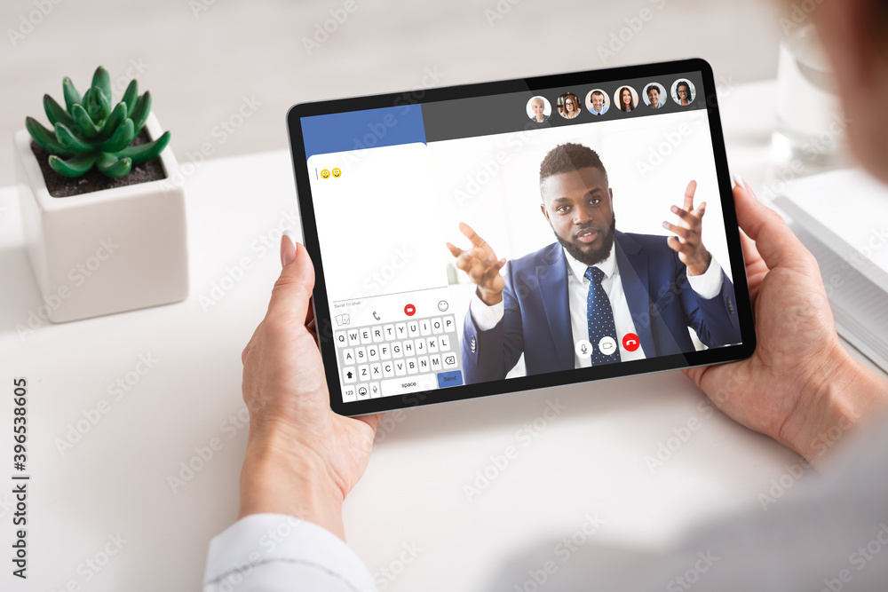 Unrecognizable lady attending online business seminar, using digital tablet Unrecognizable lady attending online business seminar, using digital tablet
