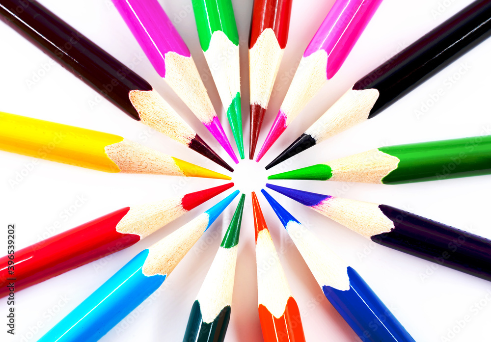 Colored pencils on a white background in the form of a circle close-up. The colors of the rainbow Colored pencils on a white background in the form of a circle close-up. The colors of the rainbow