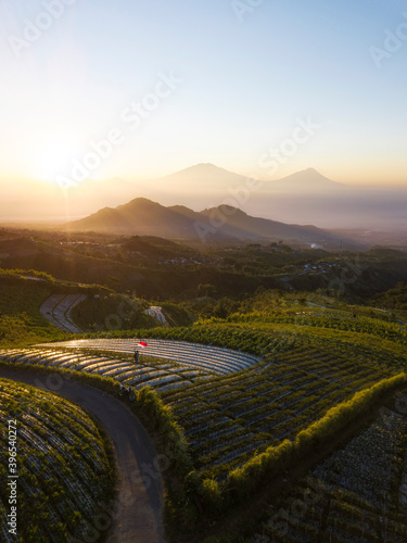Beautiful Sunrise With Mountain View And Indonesian Flag