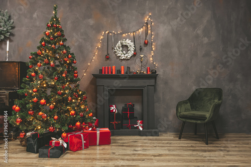 Christmas living room interior design with xmas tree decorated garland and ball, presents, gifts, fireplace and candles