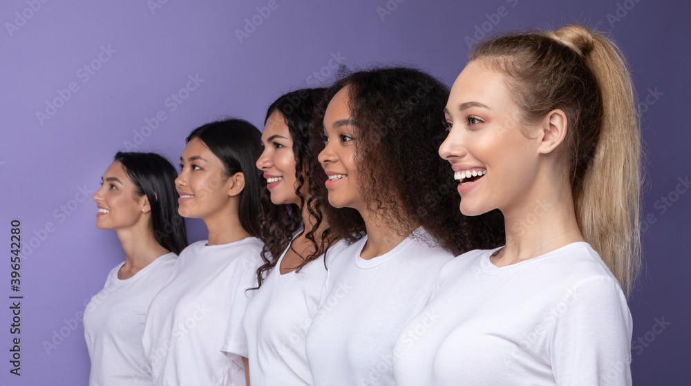 Five Smiling Diverse Women Standing In Row On Purple Background Five Smiling Diverse Women Standing In Row On Purple Background