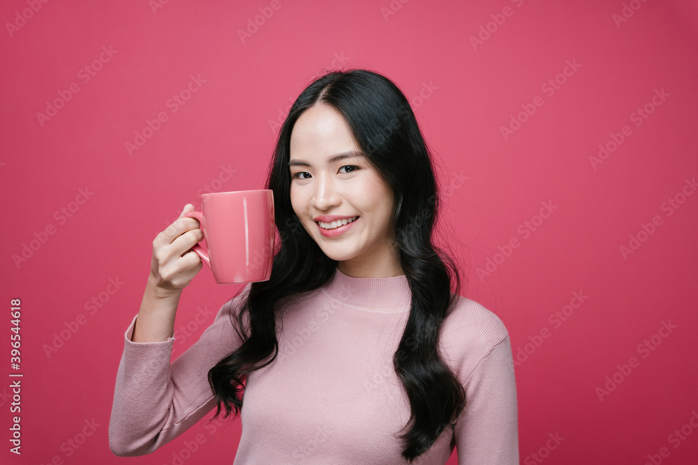Portrait of asian woman holding coffee cup isolate on pink background. Portrait of asian woman holding coffee cup isolate on pink background.