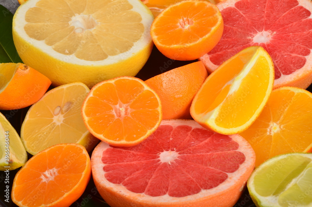 Close-up of sliced citrus fruits, Various citrus fruits, Citrus background Close-up of sliced citrus fruits, Various citrus fruits, Citrus background