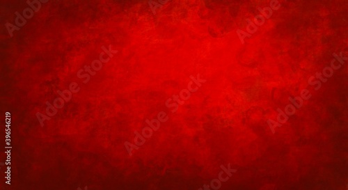 sfondo rosso natalizio con motivo sgangherato dipinto, web banner panoramico astratto con centro luminoso bianco sfocato photo