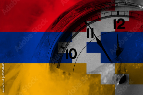 Artsakh, Artsakhtsi, Nagorno Karabakh flag with clock close to midnight in the background. Happy New Year concept photo