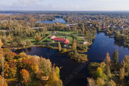 Aerial view of ancient fortress Korela in priosersk with river and park in golden autumn, red and orange colours