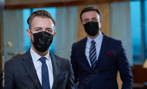 business team wearing crona virus protection face mask photo