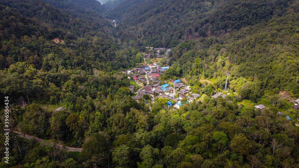 Aerial view With a small village in the middle of the forest in the green countryside Aerial view With a small village in the middle of the forest in the green countryside