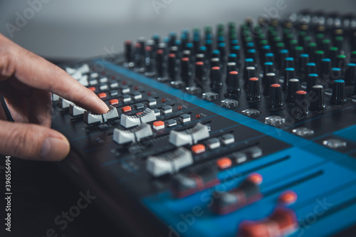 DJ playing music at mixer closeup