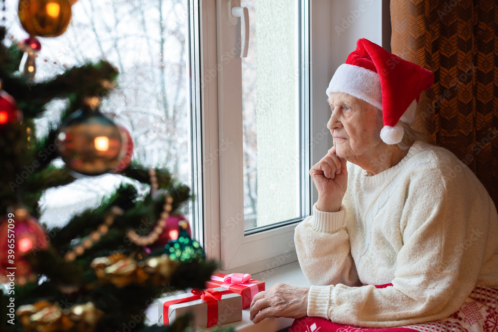 Elderly person. Christmas New Year. Portrait. Close-up.. Elderly person. Christmas New Year. Portrait. Close-up..