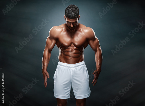 Strong Muscular Fitness Men Flexing Muscles