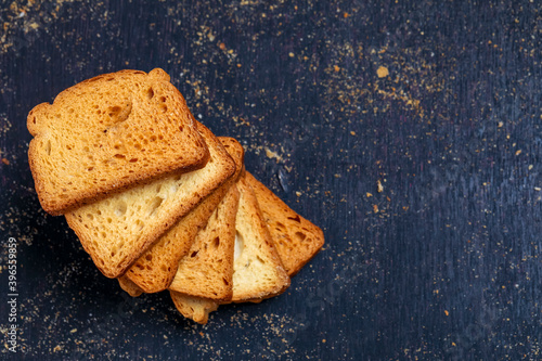 Photos crispy rusk, cake rusk over Dark background