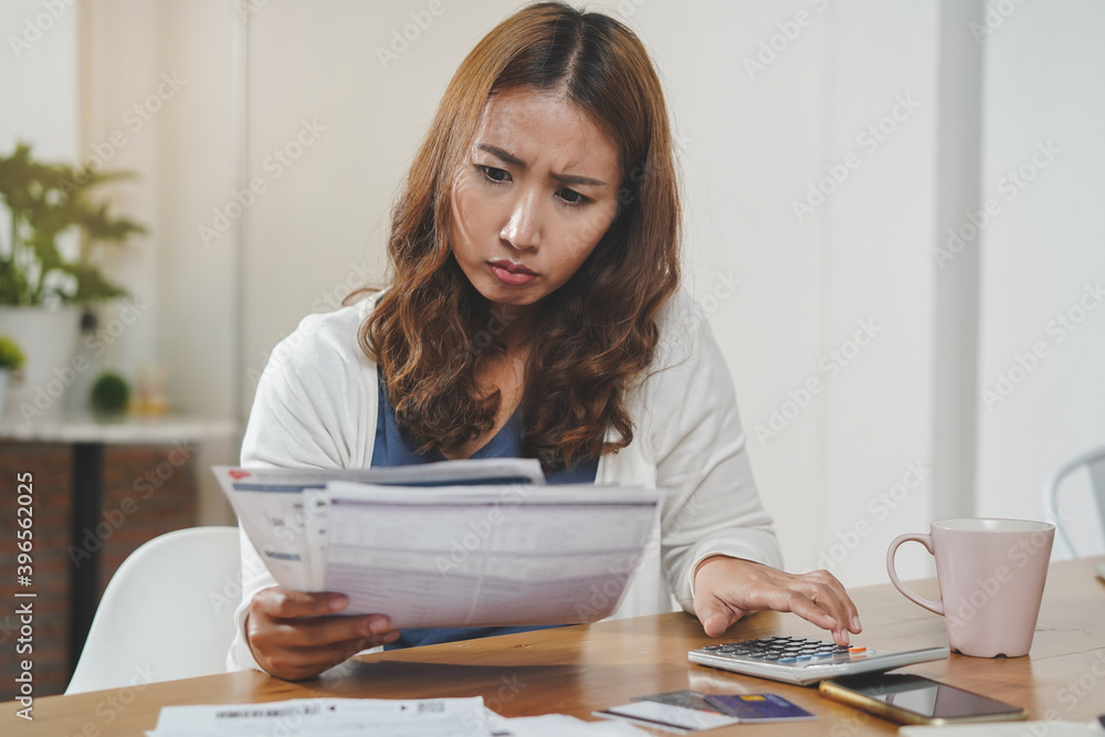 Financial household debt economy accounting concept. Close up view hands of person calculating monthly expense and management investment and payment bill invoice. Financial household debt economy accounting concept. Close up view hands of person calculating monthly expense and management investment and payment bill invoice.