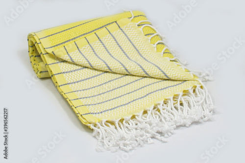 Peshtemal Turkish bath cotton towel folded textile. Beautiful bright colors with natural light background. Perfect online market digital shop sales. photo