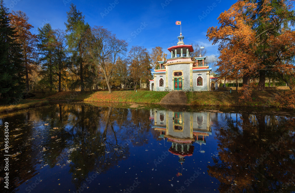 Creaking Summer-House in The Alexander Park during golden autumn, Pushkin city, Saint-Petersburg, Russia, orange leafs Creaking Summer-House in The Alexander Park during golden autumn, Pushkin city, Saint-Petersburg, Russia, orange leafs