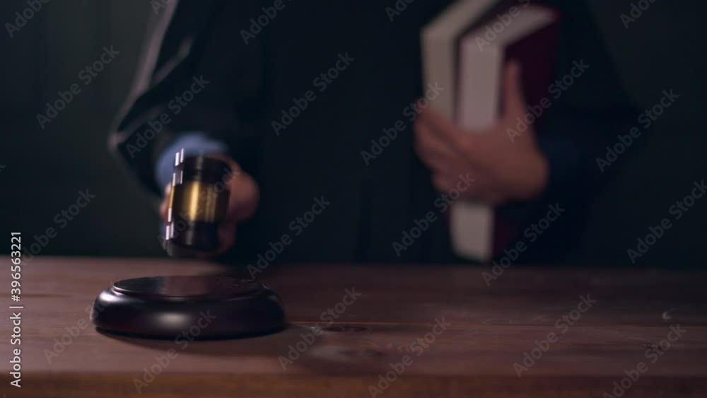 Close up of Judge hand is hitting hammer judge in courtroom Close up of Judge hand is hitting hammer judge in courtroom
