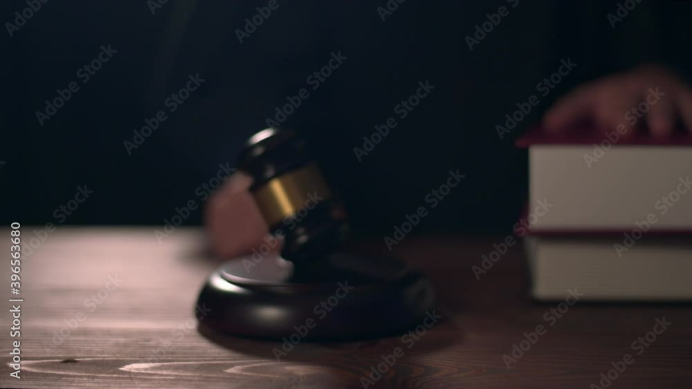 Close up of Judge hand is hitting hammer judge in courtroom Close up of Judge hand is hitting hammer judge in courtroom