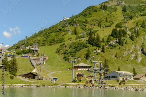 Tourists walking around lake Truebsee above Engelberg on the Swiss Alps