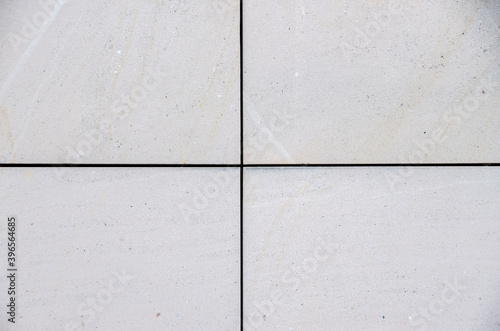 bright smooth modern sandstone facade with an regular pattern. High quality photo