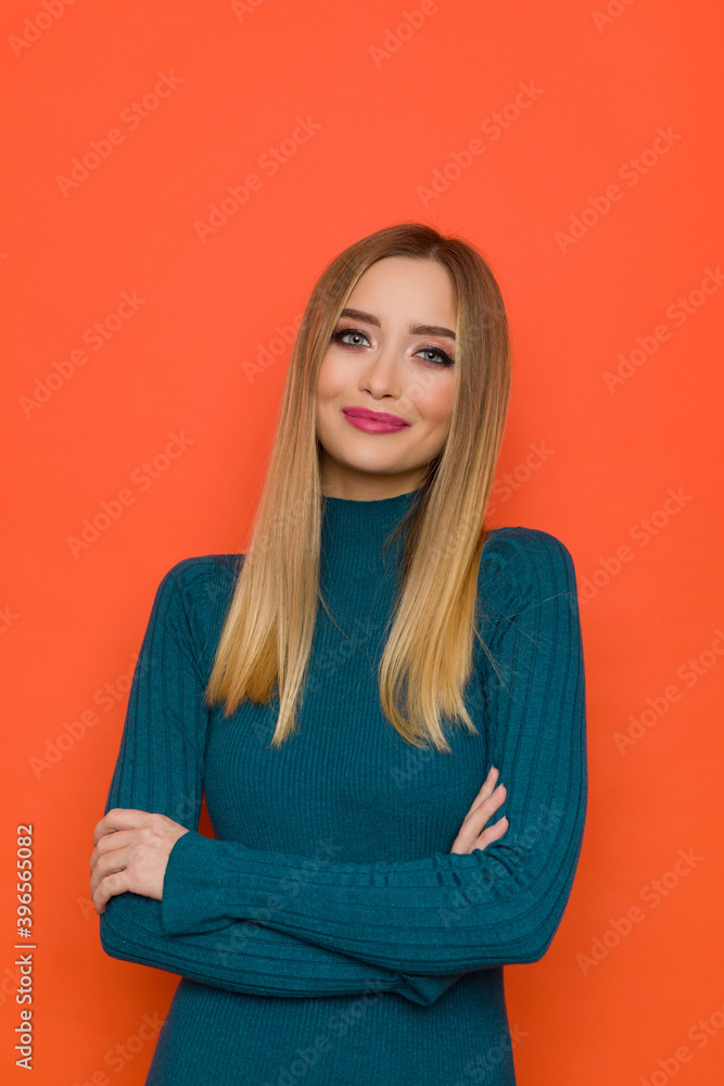 Portrait Of Beautiful Young Woman In Teal Fitted Dress Portrait Of Beautiful Young Woman In Teal Fitted Dress