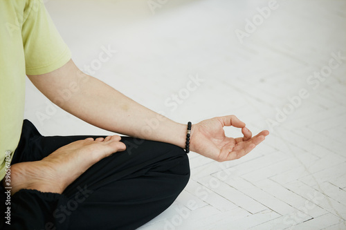 close-up of yoga mudra and lotus pose