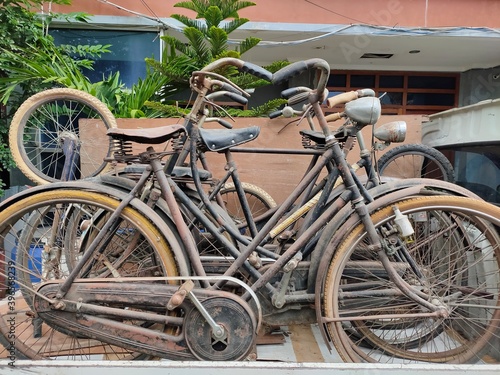 An old bicycle parked in a pickup truck