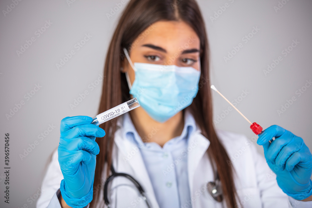 Corona virus Covid-19 respiratory sputum specimen swab test tube with gloves, mask and biohazard bag. Coronavirus or COVID-19 concept. COVID-19 Diagnostic Test. Diagnostic testing for COVID-19. Corona virus Covid-19 respiratory sputum specimen swab test tube with gloves, mask and biohazard bag. Coronavirus or COVID-19 concept. COVID-19 Diagnostic Test. Diagnostic testing for COVID-19.