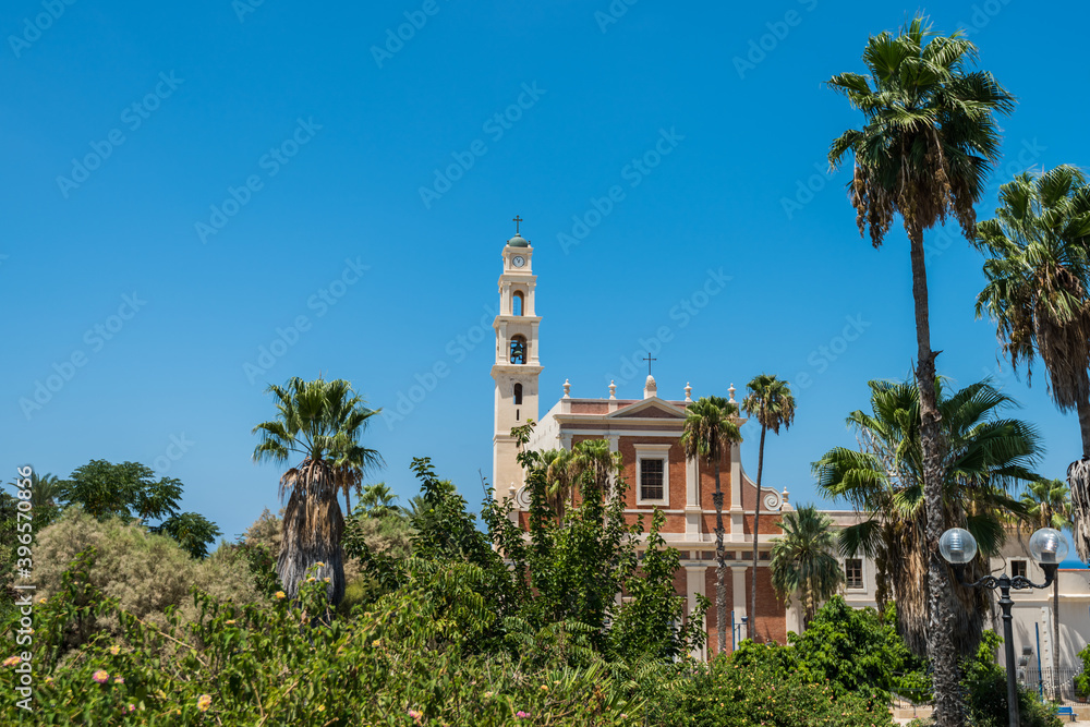 Bell tower and facade of the Saint Peter Church, Franciscan church in Old Jaffa in Tel Aviv Yaffo, Israel, View from the top of the hill in Jaffa old city.