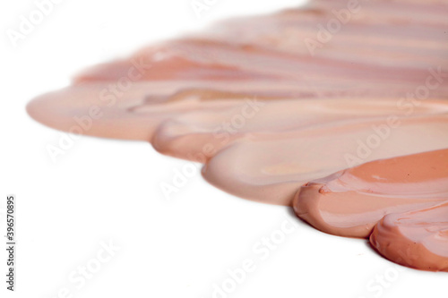 Collection of make up liquid foundation strokes isolated on a white background. 