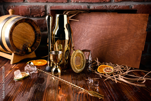 Set of bar or pub accessories with martini cocktail shaker. Set for the bartender Bar spoon, jiger, strainer photo