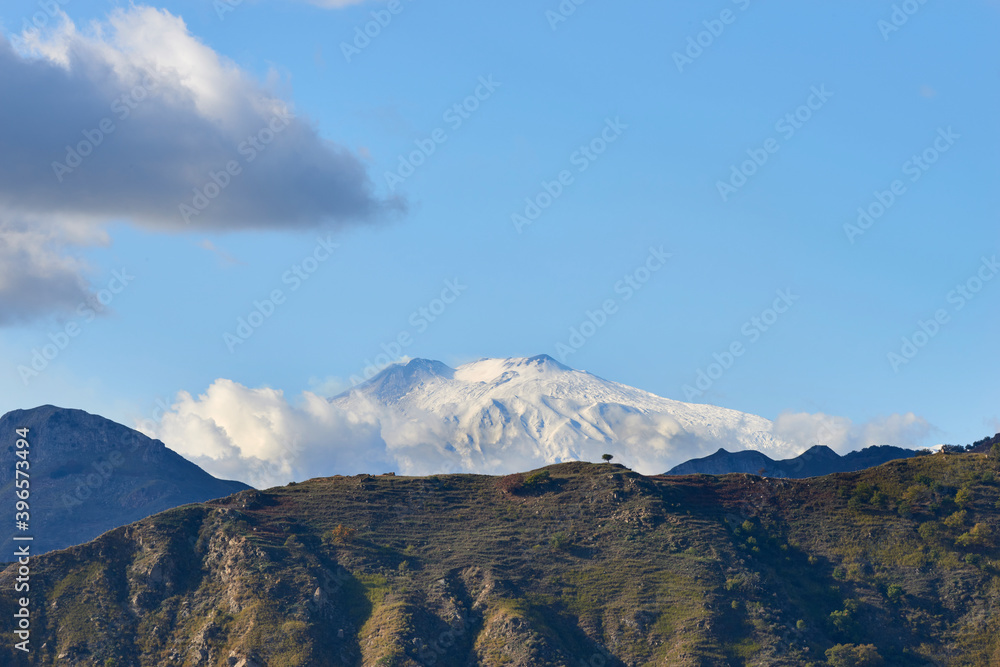 the snow-capped volcano Etna in Sicily on a sunny morning in autumn