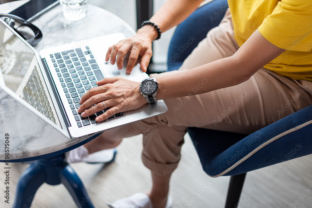 Young woman is typing messages and working on computer at home. Young woman is typing messages and working on computer at home.