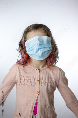 Little kid girl with a mask...