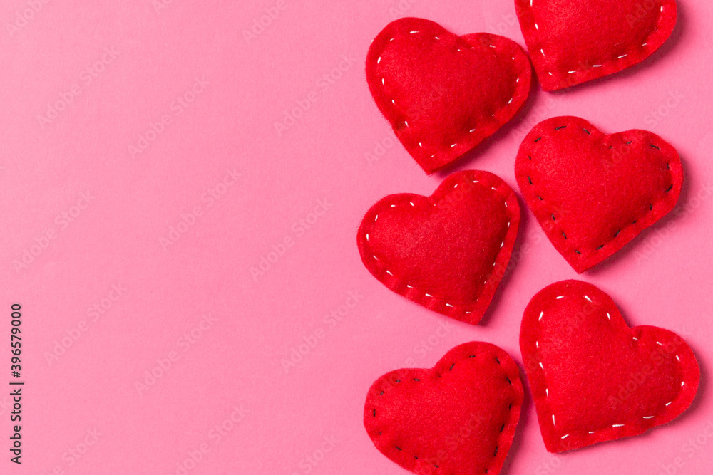 Top view of textile hearts on colorful background. Valentine's day concept with copy space