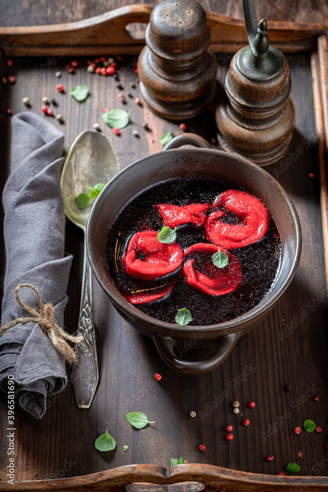 Tasty beetroot soup with fresh vegetables and dumplings Tasty beetroot soup with fresh vegetables and dumplings